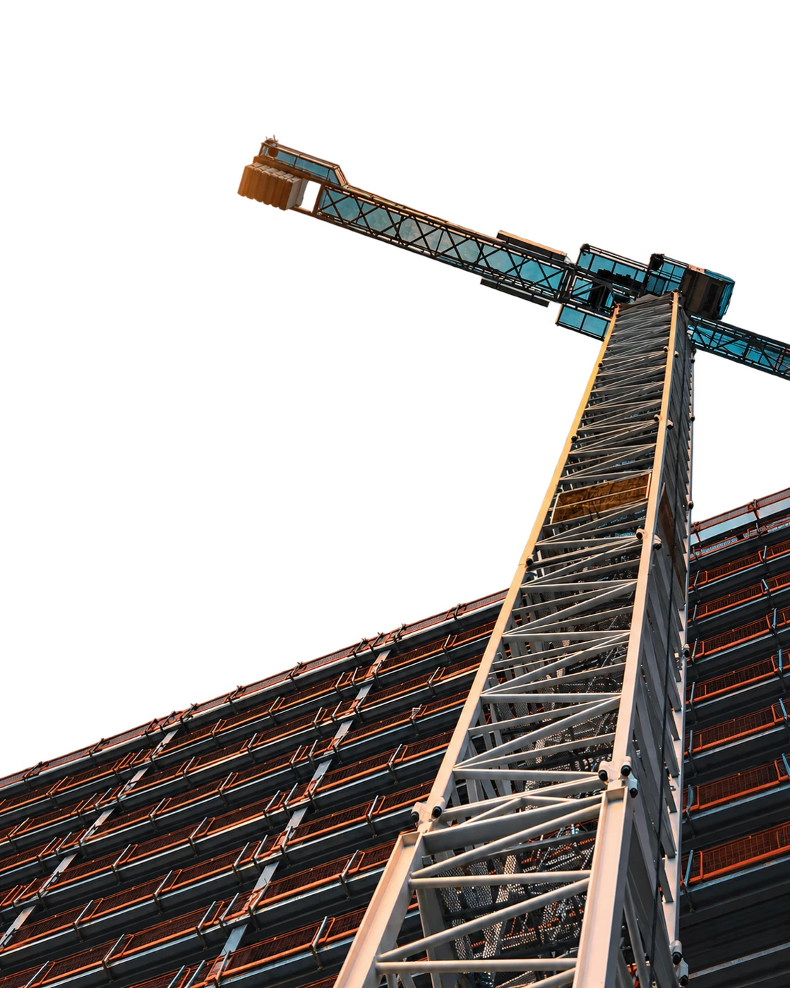 A tower crane and building under construction, extending above the green card.